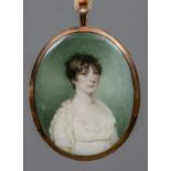 An early 19th century portrait miniature on ivory Depicting a young lady wearing a white lace dress,