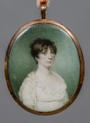 An early 19th century portrait miniature on ivory Depicting a young lady wearing a white lace dress,