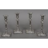 A set of four George II style silver plated candlesticks by Creswick & Co.