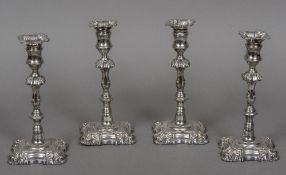 A set of four George II style silver plated candlesticks by Creswick & Co.