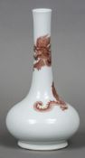 A Chinese porcelain vase Iron red decorated with a dragon,