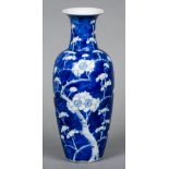 A Chinese blue and white vase Decorated in the round in the Prunus Blossom pattern,