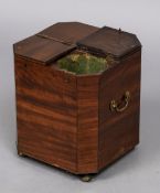 A 19th century mahogany cellaret Of chamfered square form with four hinged compartment lids,