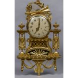 A Louis XVI style carved giltwood cartel clock The circular dial surmounted with a florally wrapped