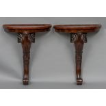 A pair of mahogany pier tables Each of demi-lune form,