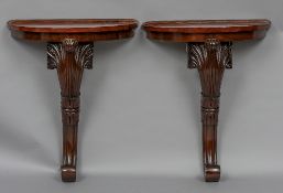 A pair of mahogany pier tables Each of demi-lune form,