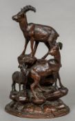 A late 19th century Blackforest carved animalier group Formed as three mountain goats. 32 cm high.