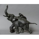 A large Japanese Meiji period bronze animalier group Formed as two tigers attacking an elephant,