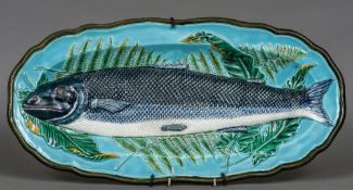 A 19th century Wedgwood majolica fish platter Moulded in low relief with a salmon resting on a bed