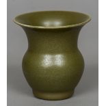A Chinese green glaze vase Of squat bulbous form with a flared rim,