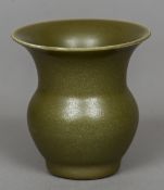 A Chinese green glaze vase Of squat bulbous form with a flared rim,