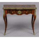 A 19th century marquetry card table The shaped hinged top with floral inlays,