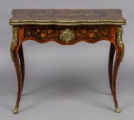A 19th century marquetry card table The shaped hinged top with floral inlays,