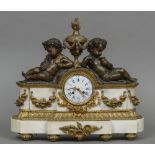 A patinated and gilt bronze mounted marble mantel clock The white enamel dial with Roman numerals