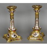 A pair of Royal Crown Derby bone china old Imari candlesticks Each with printed mark,