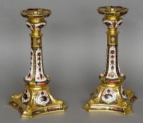 A pair of Royal Crown Derby bone china old Imari candlesticks Each with printed mark,