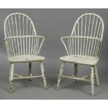 A pair of 19th century Gillow design painted stick back Windsor chairs Each with an arched back and