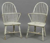 A pair of 19th century Gillow design painted stick back Windsor chairs Each with an arched back and