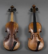 Two quarter size violins Each with a two piece back. Each 42 cm long.