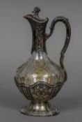 A 19th century French silver mounted etched glass claret jug With floral finial and loop handle,