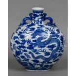A Chinese blue and white porcelain twin handled vase Decorated with five clawed dragons amongst
