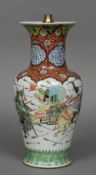 A 19th century Chinese vase Decorated in the round with warring figures, the top mounted as a lamp.