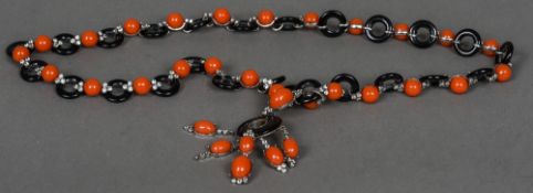 A Van Cleef & Arpels style pendant necklace Paste set simulated black onyx and coral.