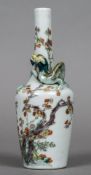 A Chinese porcelain bottle vase The slender neck encompassed by a dragon,