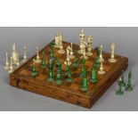 A 19th century ivory chess set Comprising: white and green stained ivory pieces;