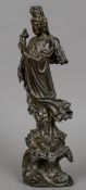 A 19th century Chinese bronze figure of Guanyin Typically modelled,