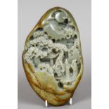 A Chinese carved green and russet jade boulder Worked with scholars before pagodas in a mountainous