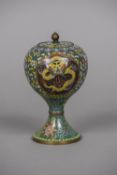 An early 20th century Chinese cloisonne vase and cover Of stemmed ovoid form,