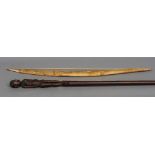 An African carved wood staff Surmounted with a tribes woman; together with a bamboo bow.