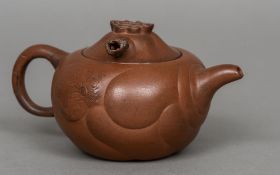 A Chinese Yixing teapot Of typical red/brown glaze, the lid set with a movable dragons head.