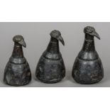 A set of three graduated North African weights Each of gourd form with bird's head finial.