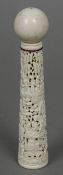 A 19th century Canton carved ivory Kendama game The plain ivory ball above the handle carved in the