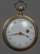 A diamond set enamel decorated yellow metal cased key wind pocket watch The white enamelled dial