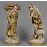 A large pair of Royal Dux porcelain figures One formed as a hunter carrying a deer,