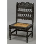 An 17th/18th century Colonial Dutch Indian carved ebony side chair With ornately pierced and turned