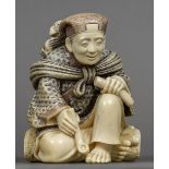 A late 19th/early 20th century Japanese ivory okimono Formed as a gentleman holding pipe with a