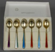 A matched set of eight Norwegian silver gilt and enamel coffee spoons,