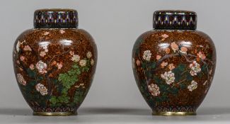 A pair of late 19th century cloisonne vases and covers Each of ovoid form,