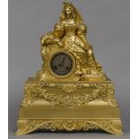 A French Empire ormolu cased mantle clock The silvered dial with Roman numerals and bell striking