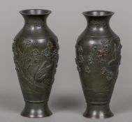 A pair of 19th century Japanese bronze and copper vases Each of slender ovoid form,