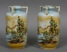 A pair of Noritake vases Each of ovoid form, decorated with a tree lined mountainous landscape.
