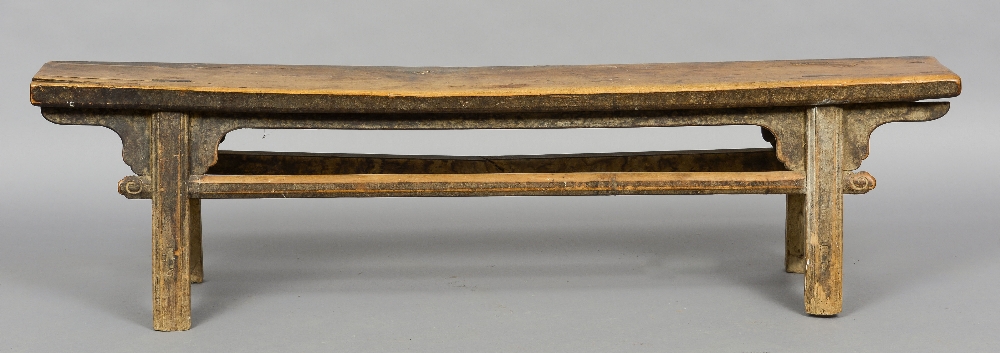 An 18th/19th century Chinese hardwood bench The moulded splayed legs with shaped brackets and