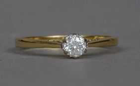 An 18 ct gold diamond solitaire ring The claw set stone approximately 0.25 carat.