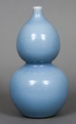 A Chinese blue ground double gourd vase The underside with blue painted seal mark. 24.5 cm high.