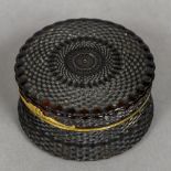 An 18th century pressed tortoiseshell yellow metal mounted snuff box Of circular form,