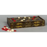 A 19th century Cantonese lacquered games box Of typical hinged form,